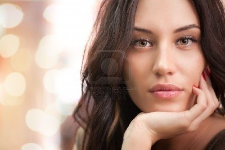 7338365-portrait-of-attractive-brunette-girl-with-bokeh-lights-on-background